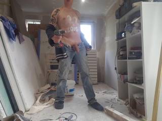 paul working in denim pants on his house building site