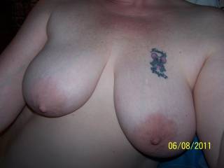 My wife showing off her big titties and her tattoo