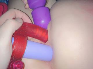 Another picture of me playing with two toys at the same time and getting both my pussy and asshole filled up at the same time. It felt so fucking good as he pushed them both inside me hard and fast over and over!