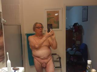 In the bathroom in front of the large mirror. Like I said, I\'m working on the fat.