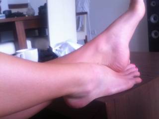 Laying naked on the sofa with my feet out.. I love feet. Send me your photos of your feet to make me wet!!