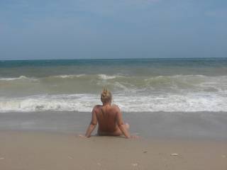my wife relaxing in the nudist beach