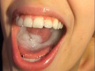 Still playing with his sweet cum in my mouth before swallowing