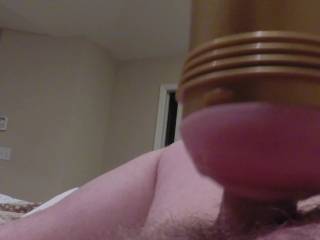 Im very horny and cant contain myself any longer. I stroke with the fleshlight for some relief.