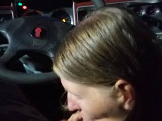sucking hubby cock in the front seat parked at a truck stop