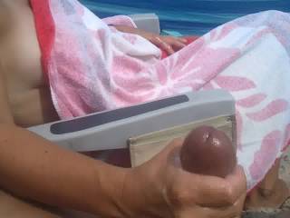 Wife jerking my big cock to a huge cumshot at the beach, What do you think of that cock?