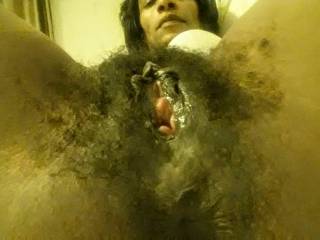Exstreamly hairy ebony.  Wet  pussy