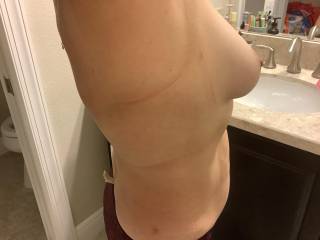I like to make guys get hard ons by sucking my boobs