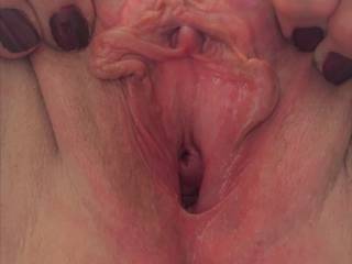 spreading her pussy for your viewing pleasure