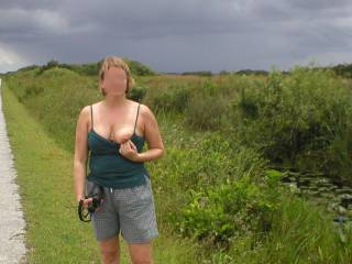 Shark Valley in the Florida Everglades.
The guy in the background is my buddy, Doug.
Little did he know that on the ride back to his house he'd get a blow job from Nina.
He kept asking "Are you sure you're ok with this?"