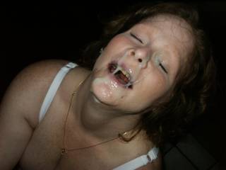 Another shot of her wearing a huge cum load from some strange cock.  Do you think she did a good job draining his balls?