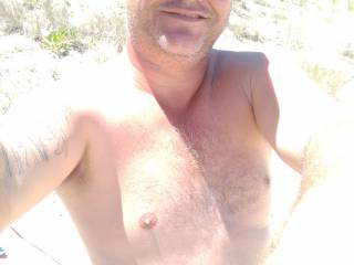 At the nudist beach