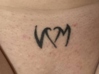 Initials and a heart tight above my pussy