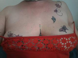 My Sussex Submissive proudly showing her tattoos in her lace top dress.