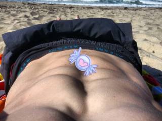 Lonely guy on beach with candy on my abs!