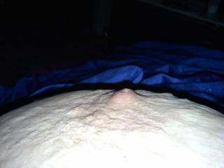 a shot of my nipple at night.. looking perky