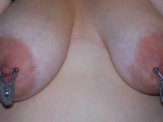 A little closer pic of Wifey's new Dangling Chain nipple rings. Do you like them? Wifey LOVES pulling on them!  ;