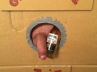 Look what I have just found, my very own gloryhole! Should I suck on the cock or have the beer?