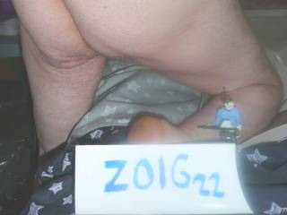 Kneeling on my bed showing my butt & Star Trek ornament. Camera used Z3 Panasonic.