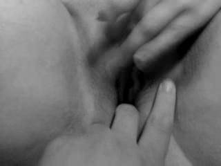 A close up of my wife rubbing her clit. Black & White