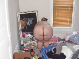 A quick bend over ass flash while going through her messy room to find panties