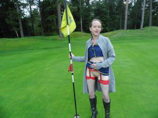 Joanne flashing on a golf course
