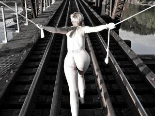 During my photo shoot with Mia, had this crazy idea to use a rope in a none bondage way on the railroad bridge.  I liked some of the photos that resulted.