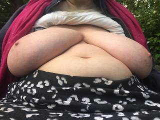 We are on top of a hill, my friend sits on a seat next to woodland. She slumps down, legs apart, so I get in and take a picture of her flopped-out resting big tits. Lovely ;)