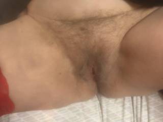 Legs spread wide and hairy pussy gaping for some action.
