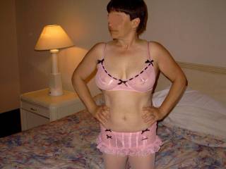 My wife posing in pink lingerie.