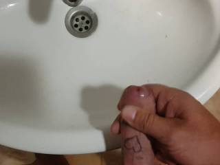 On holiday feeling good. So went to the bathroom for a quick wank.  The cum went down the drain. Shame as i love to swollow cum.