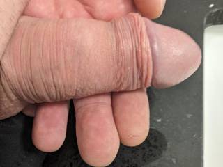 Soft uncut cock rest in palm ready to be pumped