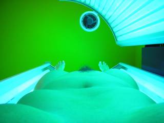 My little strip of pussy hair sticking up in the tanning bed  U like?