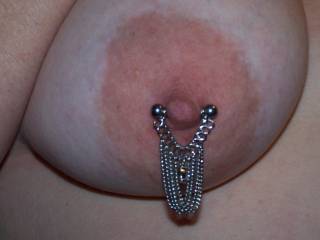Close-Up of Wifey\'s right breast with her Dangling Chain nipple ring. We really had fun playing with these last night!