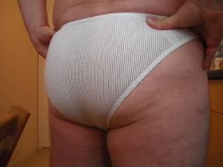 I love the way tight shorts and briefs accentuate the contours of men's asses.  This is my ass in a one of my favourite pairs of white briefs and I hope you like what you see