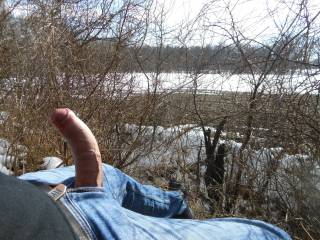 I was walking thru the cold spring and get horny... so i sit down, unzip my jeans and let my cock chillin in the sun...near a hiking path (video soon).