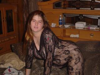 Sexy lady in one hot bodystocking.  Love the tattoo as well.
Very hot pic.