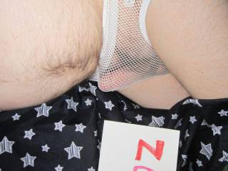 Wearing a white mesh undie with erection showing. Camera used, Canon 300.