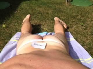 Lounging in white Joe Snyder thong.