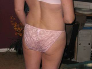 Love your sexy pink panties. I really like seeing the smooth shiny material stretched across your cute little ass.