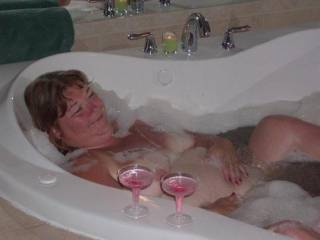 Taking the time to chill and enjoy some champagne and a bubble bath in between being naughty. Do I look mischevious?