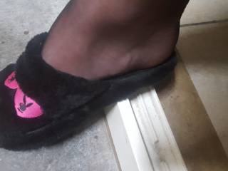 Black stockings with black playboy slippers