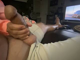 Watching tv and getting a nice hand job