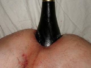 champagne bottle in ass
