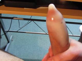 Me filling up a condom with a huge load of hot cum.