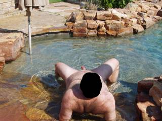 Hubby naked and nervous in our pool...our female neighbor was in her back yard with her female friends and hubby's cock was open for display!  I wonder if they got a look?  It made me wet and horny for sure seeing my man naked and vulnerable!!!