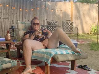 Wife teasing with her pussy in the back yard