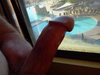 Jacking my horny prick in the hotel window.  Love to expose my cock.