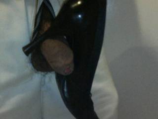 Playing around with her high heels shoe. It's fun to balance it on my cock.