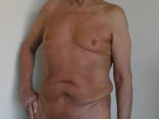 Naked and horny with a hard cock wait for you suck me off.